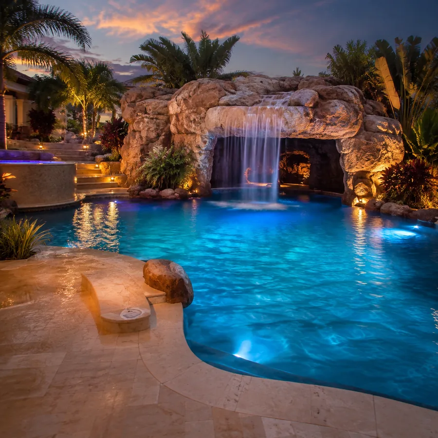 Resort pool with stone grotto and waterfall