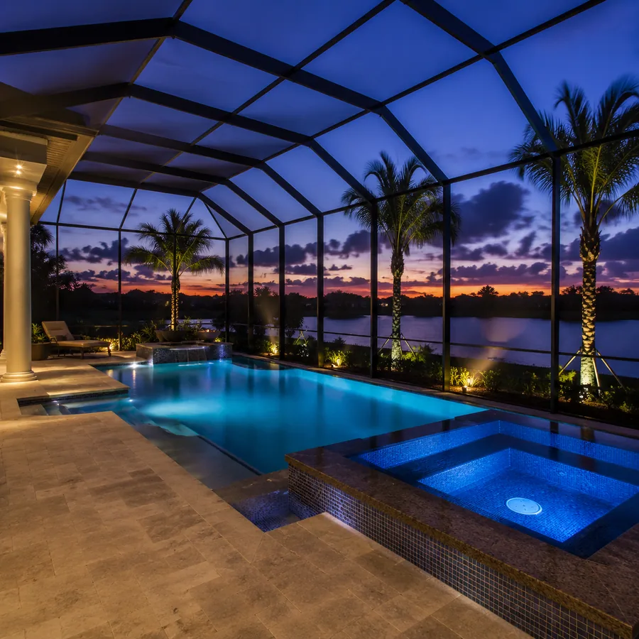 Screened lanai pool enclosure at twilight